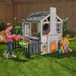 Casuta de joaca Cuptorul cu Lemne Kidkraft Cozy Hearth - Casa cu LEDuri pentru copii cu pridvor si bancute cu bucatarie si accesorii Cabin PlayHouse